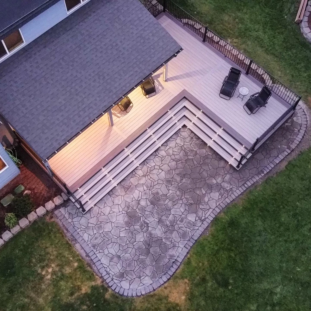 Deck with cover, stairs, and lighting.