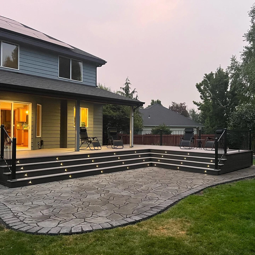 Deck with stairs a cover and lights.