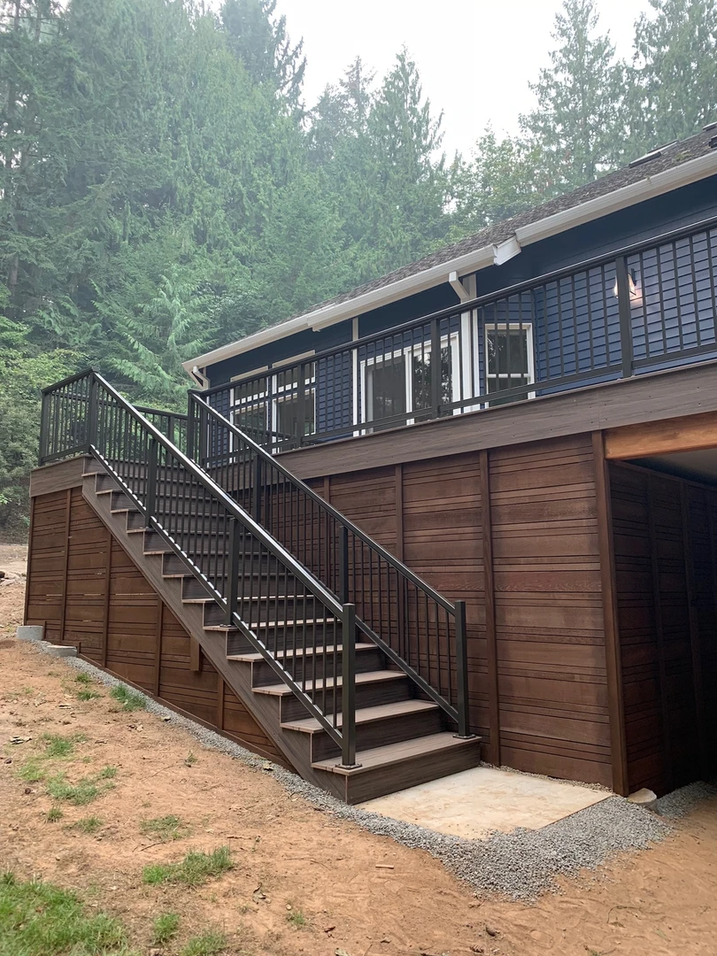 New aluminum railing installed on a new deck. Pulled mineral based decking installed with hidden fasteners. Deckorators Khaya decking installed on new deck. 