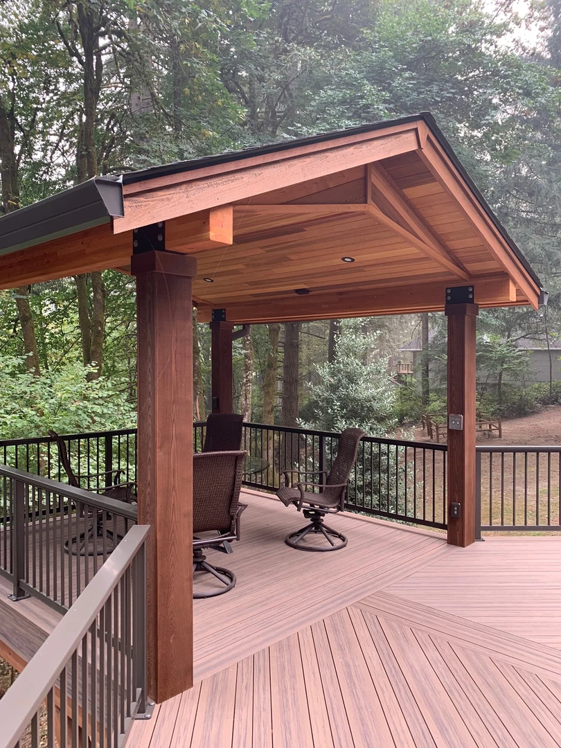 Aluminum or zinc cable railing. Stainless steel cable railing infill with powder coated aluminum posts. Railing installed on existing deck. 